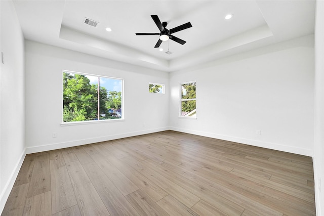 5107 New Orleans St, Houston, TX 77020 - unfurnished room featuring a raised ceiling, hardwood / wood-style flooring, baseboards, recessed lighting, and ceiling fan