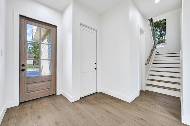 5107 New Orleans St, Houston, TX 77020 - entrance foyer with light wood finished floors, baseboards, stairs, and recessed lighting