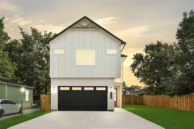 5107 New Orleans St, Houston, TX 77020 - view of front of home with board and batten siding, driveway, and a garage
