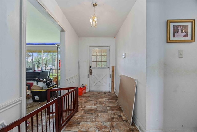 2138 Clifford St, Alvin, TX 77511 - entrance foyer with plenty of natural light, a chandelier, and stone finish flooring