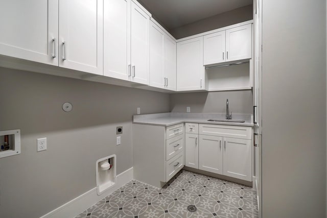 2920 Georgetown St, Houston, TX 77005 - laundry area with cabinet space, washer hookup, electric dryer hookup, baseboards, and light tile patterned flooring