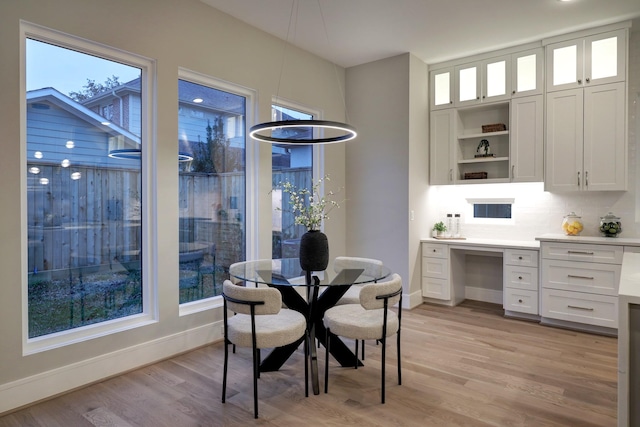 2920 Georgetown St, Houston, TX 77005 - dining space with baseboards and light wood-style flooring