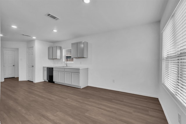 4625 Peralta Heights Way, Porter, TX 77365 - kitchen with gray cabinetry, dishwasher, dark wood-style floors, recessed lighting, and light countertops