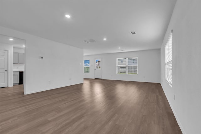 4625 Peralta Heights Way, Porter, TX 77365 - unfurnished living room with recessed lighting and wood finished floors