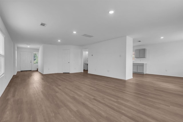 4625 Peralta Heights Way, Porter, TX 77365 - unfurnished living room with recessed lighting and wood finished floors