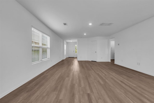 4625 Peralta Heights Way, Porter, TX 77365 - unfurnished living room with recessed lighting and wood finished floors