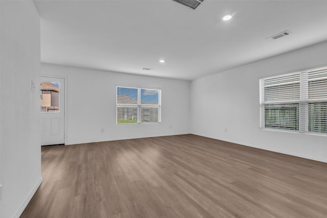 4625 Peralta Heights Way, Porter, TX 77365 - unfurnished room with wood finished floors, healthy amount of natural light, and recessed lighting