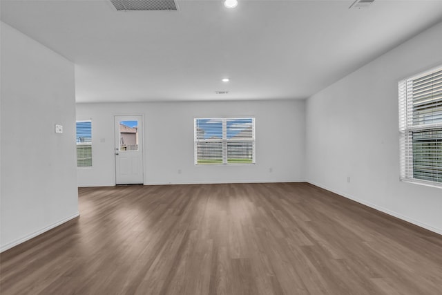 4625 Peralta Heights Way, Porter, TX 77365 - unfurnished room with healthy amount of natural light, wood finished floors, and recessed lighting