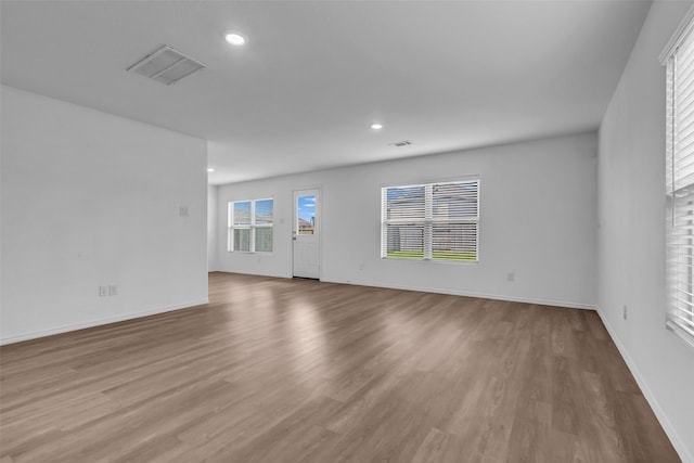 4625 Peralta Heights Way, Porter, TX 77365 - unfurnished living room featuring wood finished floors and recessed lighting