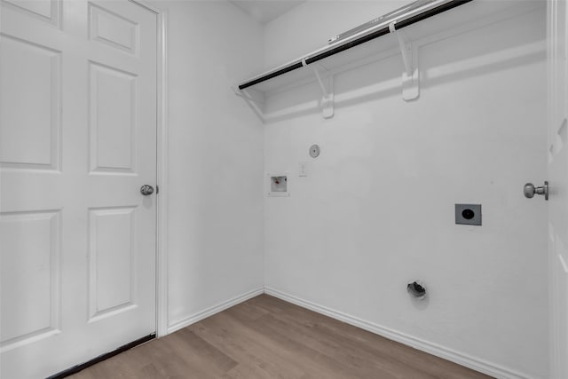 4625 Peralta Heights Way, Porter, TX 77365 - washroom featuring hookup for an electric dryer, wood finished floors, hookup for a washing machine, and gas dryer hookup