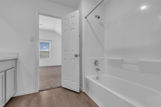 4625 Peralta Heights Way, Porter, TX 77365 - bathroom with wood finished floors, shower / bathtub combination, vanity, and lofted ceiling