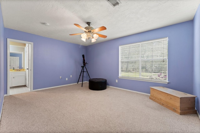 3027 Pine Acres Dr, Conroe, TX 77384 - misc room featuring carpet, a ceiling fan, baseboards, and a textured ceiling