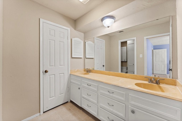 3027 Pine Acres Dr, Conroe, TX 77384 - full bath featuring double vanity, tile patterned floors, toilet, and baseboards