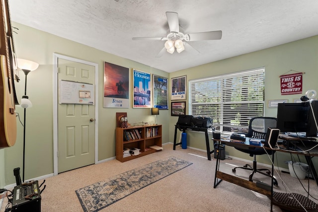 3027 Pine Acres Dr, Conroe, TX 77384 - office featuring a ceiling fan, carpet, baseboards, and a textured ceiling