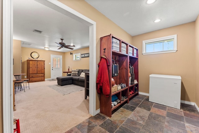 3027 Pine Acres Dr, Conroe, TX 77384 - mudroom with ceiling fan, healthy amount of natural light, baseboards, stone tile floors, and recessed lighting