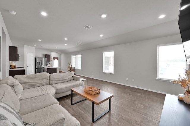 13916 Great Pines Ct, Conroe, TX 77302 - living area with wood finished floors, recessed lighting, and baseboards