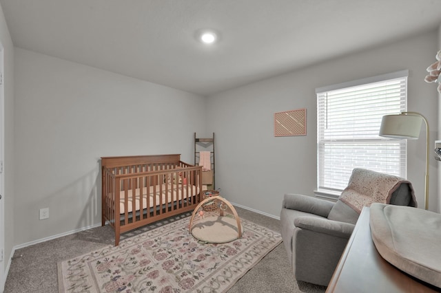 13916 Great Pines Ct, Conroe, TX 77302 - carpeted bedroom featuring baseboards and a nursery area