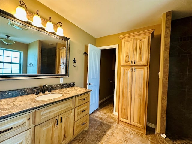 304 Ashwood Bnd, Hudson, TX 75904 - bathroom with vanity, tiled shower, and tile patterned floors