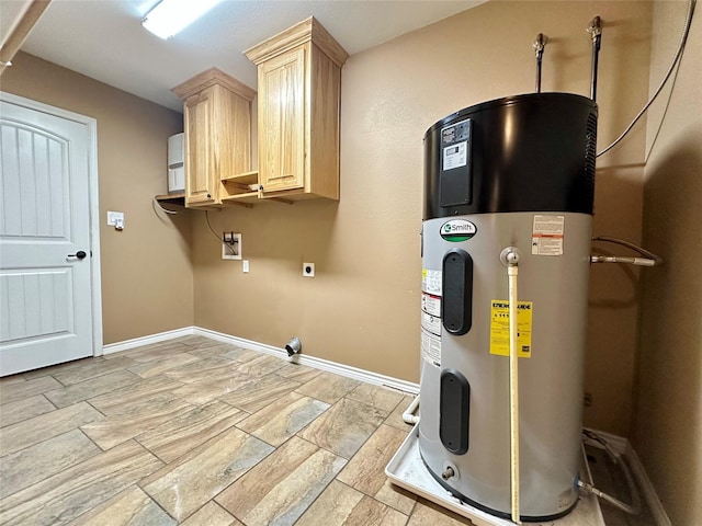 304 Ashwood Bnd, Hudson, TX 75904 - laundry area with hybrid water heater, cabinet space, hookup for an electric dryer, hookup for a washing machine, and baseboards