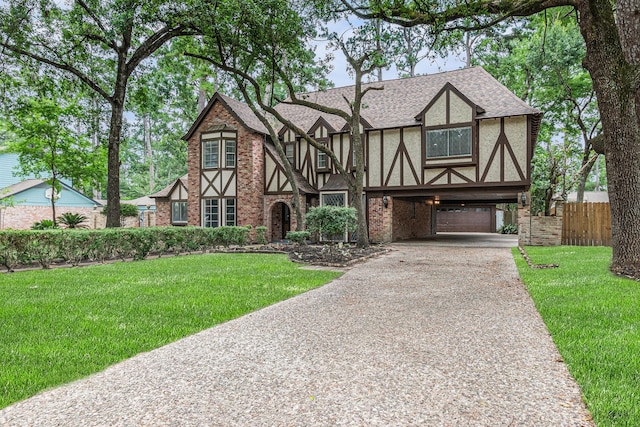 6307 Bayonne Dr, Spring, TX 77389 - english style home with driveway, a carport, roof with shingles, brick siding, and stucco siding