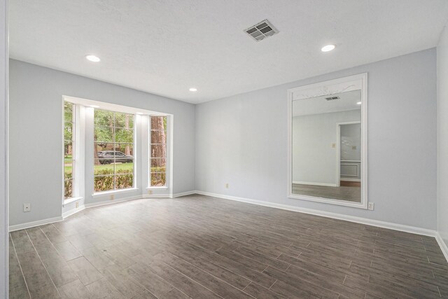 6307 Bayonne Dr, Spring, TX 77389 - spare room with dark wood-type flooring, baseboards, and recessed lighting