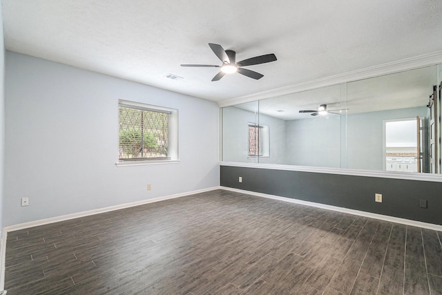 6307 Bayonne Dr, Spring, TX 77389 - unfurnished room with ceiling fan, plenty of natural light, dark wood-type flooring, and ornamental molding