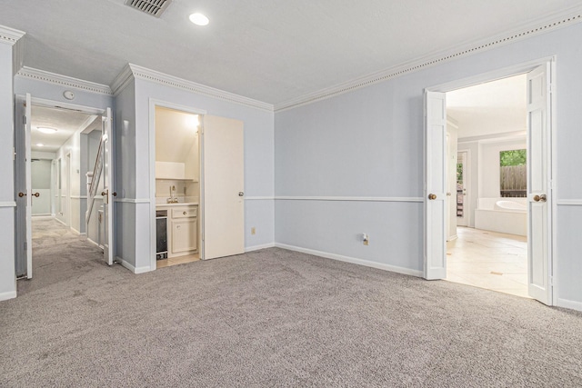 6307 Bayonne Dr, Spring, TX 77389 - unfurnished bedroom with crown molding, carpet flooring, connected bathroom, and baseboards