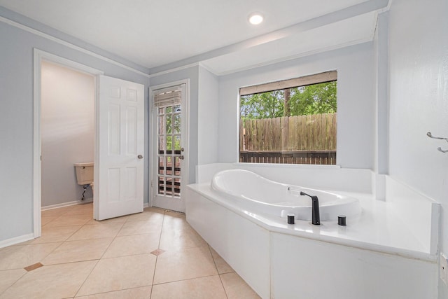 6307 Bayonne Dr, Spring, TX 77389 - bathroom with a garden tub, tile patterned flooring, and baseboards