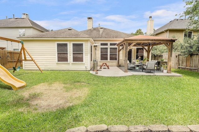17206 Kobuk Valley Cir, Humble, TX 77346 - rear view of house with a gazebo, a patio, a playground, and outdoor lounge area