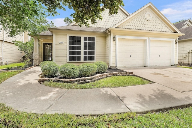 17206 Kobuk Valley Cir, Humble, TX 77346 - view of front of home with a garage and driveway