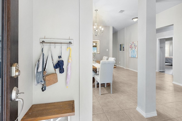 17206 Kobuk Valley Cir, Humble, TX 77346 - hall featuring a chandelier, light tile patterned floors, and baseboards