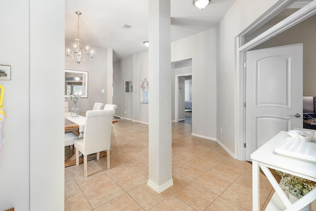 17206 Kobuk Valley Cir, Humble, TX 77346 - dining area with a chandelier, light tile patterned floors, and baseboards