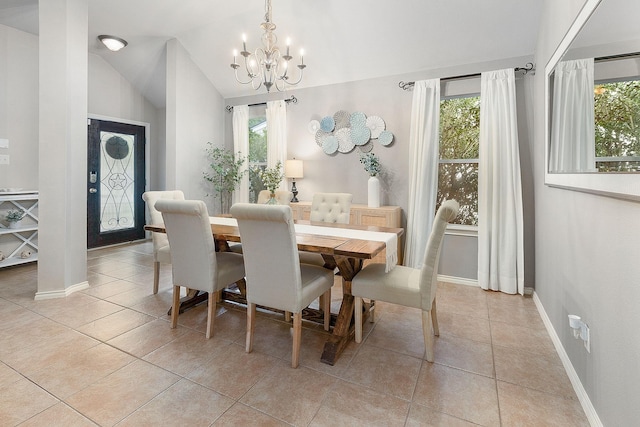17206 Kobuk Valley Cir, Humble, TX 77346 - dining space with a chandelier, baseboards, light tile patterned floors, and vaulted ceiling