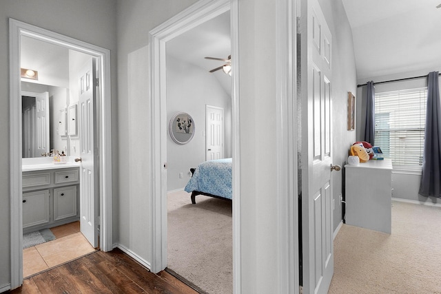 17206 Kobuk Valley Cir, Humble, TX 77346 - hall with baseboards, dark colored carpet, and vaulted ceiling