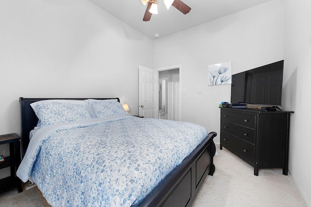 17206 Kobuk Valley Cir, Humble, TX 77346 - bedroom featuring light colored carpet, high vaulted ceiling, a ceiling fan, and baseboards