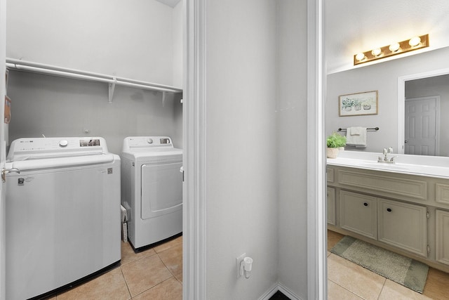 17206 Kobuk Valley Cir, Humble, TX 77346 - laundry area with washer and dryer and light tile patterned flooring