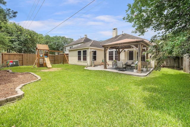 17206 Kobuk Valley Cir, Humble, TX 77346 - rear view of property featuring a patio, a gazebo, a playground, outdoor lounge area, and a chimney