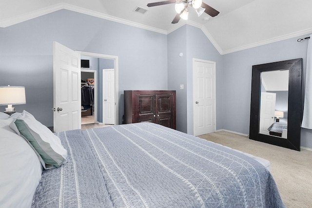 17206 Kobuk Valley Cir, Humble, TX 77346 - carpeted bedroom with lofted ceiling, a walk in closet, a ceiling fan, baseboards, and ornamental molding