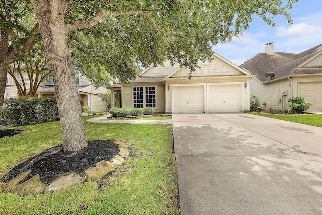 17206 Kobuk Valley Cir, Humble, TX 77346 - view of front of house featuring a garage, concrete driveway, and a front lawn