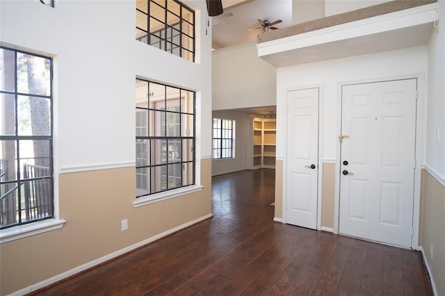 16800 Sugar Pine Dr Unit F44, Houston, TX 77090 - foyer with ceiling fan, wood finished floors, baseboards, and a high ceiling