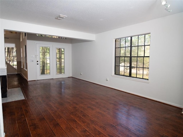 16800 Sugar Pine Dr Unit F44, Houston, TX 77090 - spare room featuring dark wood-type flooring and baseboards