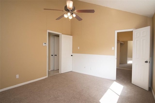 16800 Sugar Pine Dr Unit F44, Houston, TX 77090 - carpeted spare room with ceiling fan, a wainscoted wall, and high vaulted ceiling