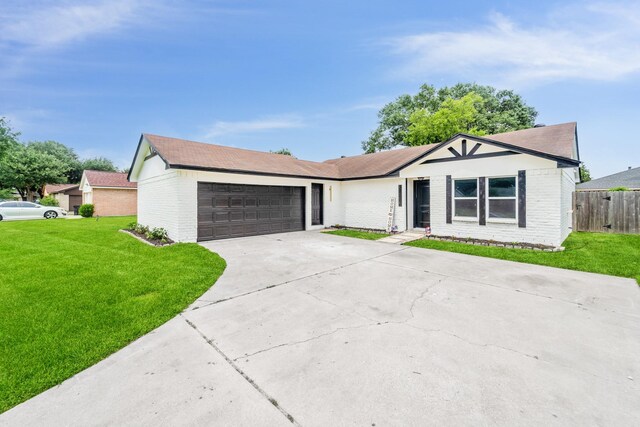 11114 Daybreak Ln, Cypress, TX 77429 - view of front of home with an attached garage, driveway, and brick siding