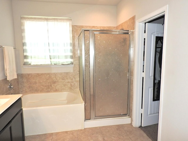 2705 Osprey Ln, Pearland, TX 77581 - bathroom with tile patterned floors, a shower stall, vanity, and a bath