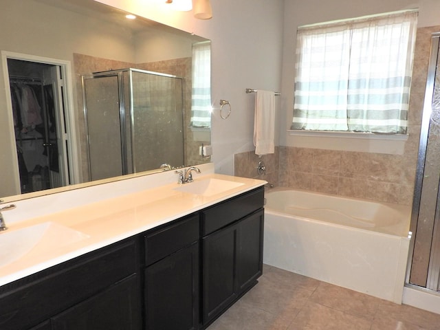 2705 Osprey Ln, Pearland, TX 77581 - full bath with a garden tub, tile patterned flooring, a stall shower, double vanity, and a walk in closet