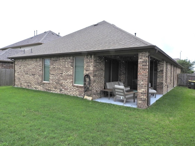 2705 Osprey Ln, Pearland, TX 77581 - back of property featuring a patio, a shingled roof, and brick siding