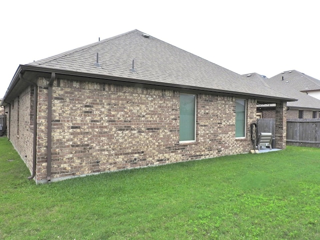 2705 Osprey Ln, Pearland, TX 77581 - rear view of house featuring brick siding and roof with shingles