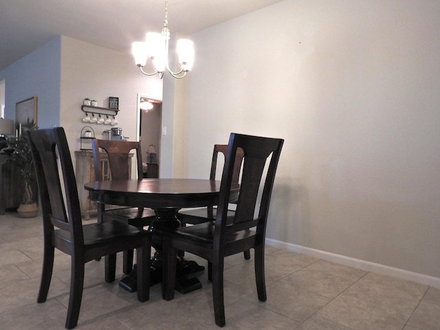 2705 Osprey Ln, Pearland, TX 77581 - dining room with a chandelier, baseboards, and light tile patterned flooring