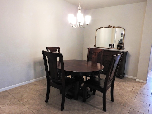 2705 Osprey Ln, Pearland, TX 77581 - dining room featuring a chandelier, baseboards, and light tile patterned floors