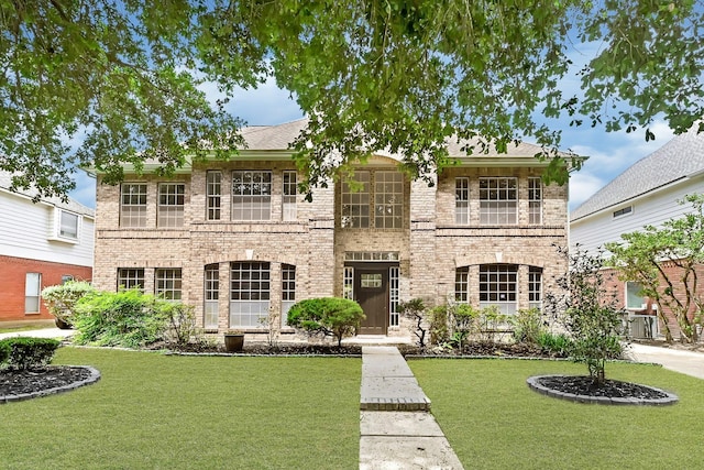1826 Cheyenne River Cir, Sugar Land, TX 77478 - view of front facade with a front lawn and brick siding